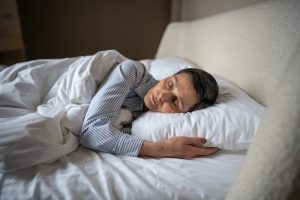 Persona a letto, immagine legata ai sintomi neurologici e al malessere post-sforzo della ME/CFS